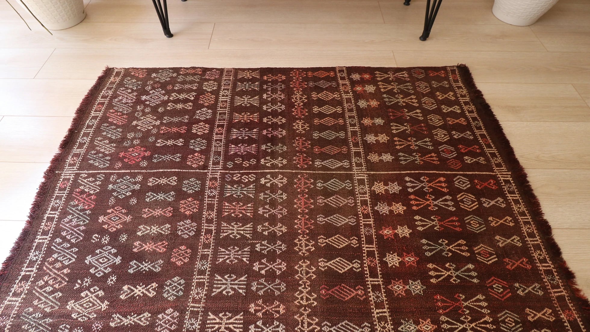 mid-century handmade Moroccan flat-woven kilim rug with tribal motifs in muted earthy taupe and terracotta shades measuring 3x5 ft
