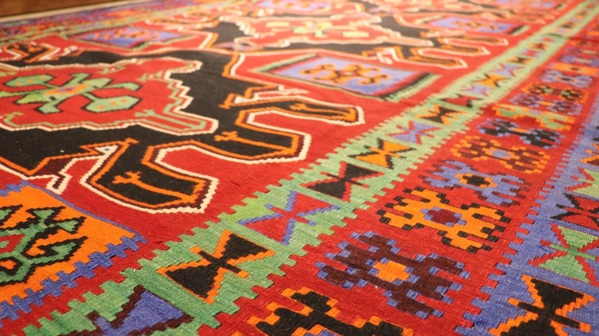 very fine and rare Caucasian gallery runner rug showcasing many traditional motifs and charming geometric medallion patterns in red, black, green, and blue