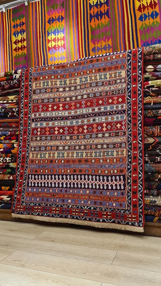 Vintage Persian Sumak Oriental Rug in red featuring a lot of distinctive traditional Persian motifs