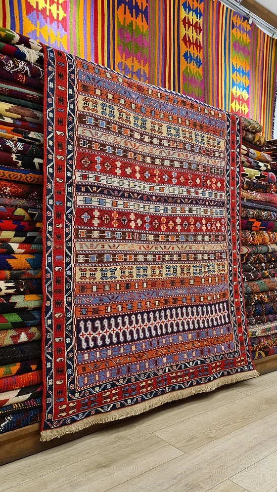 Vintage Persian Sumak Oriental Rug in red featuring a lot of distinctive traditional Persian motifs