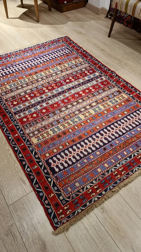 Vintage Persian Sumak Oriental Rug in red featuring a lot of distinctive traditional Persian motifs