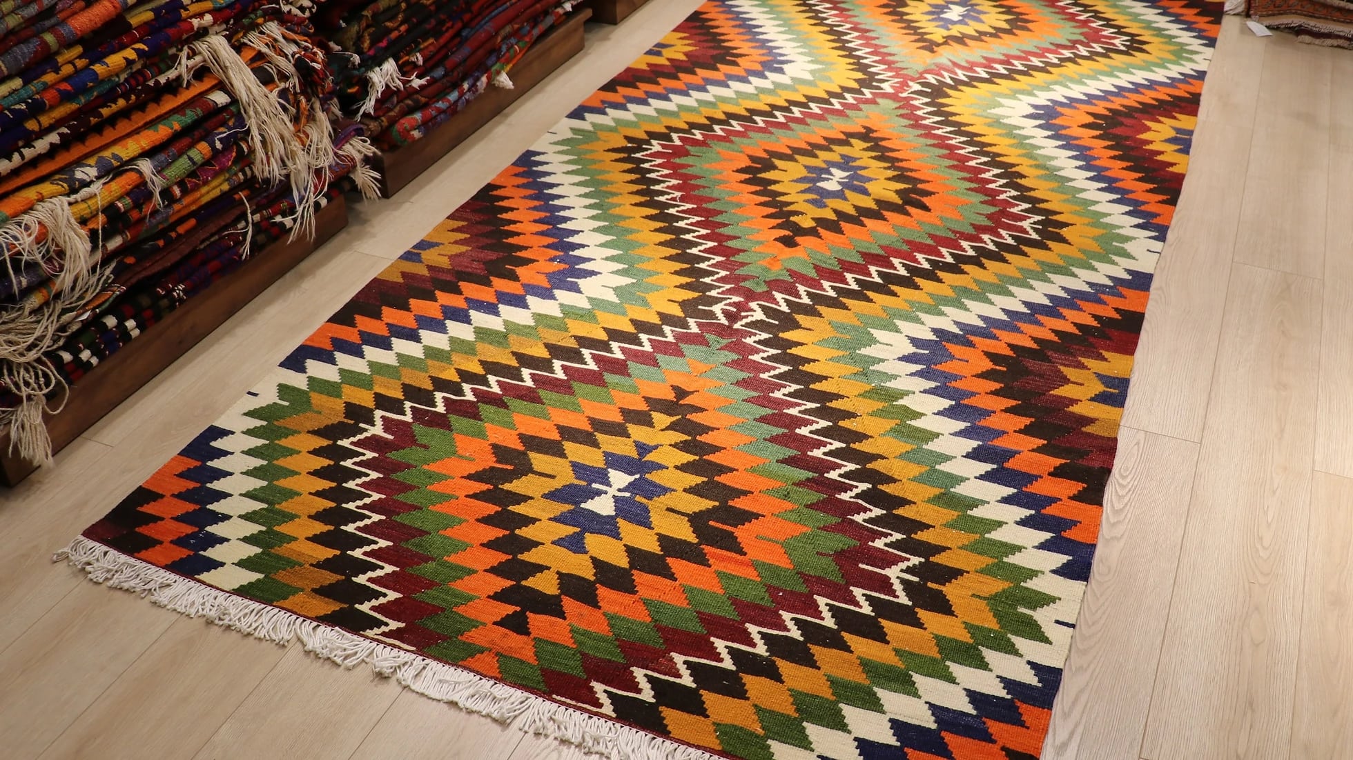 Diamond patterned Turkish kilim rug in orange with tassels