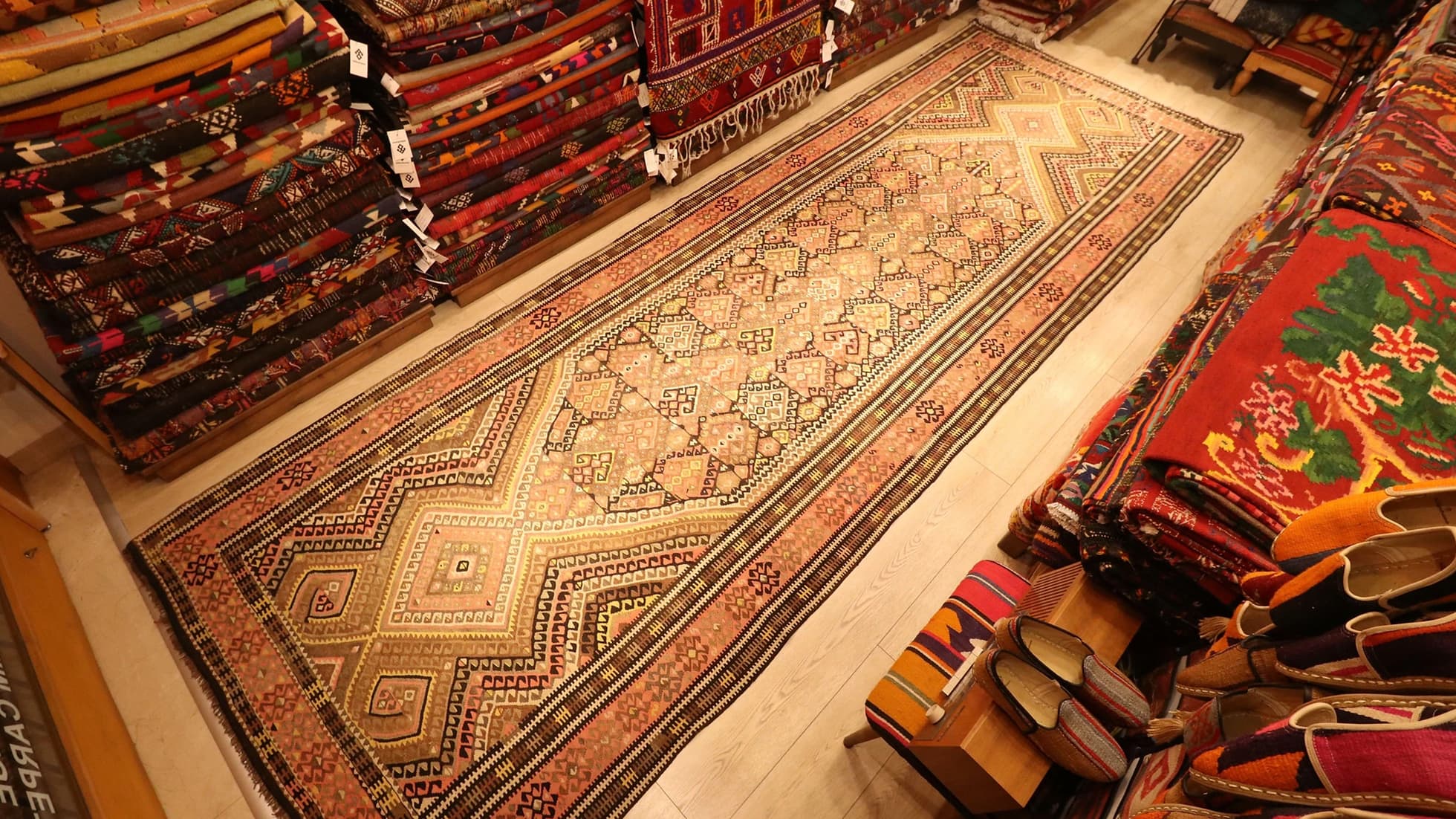 traditional Oushak runner kilim rug is displayed in a rug store in NYC
