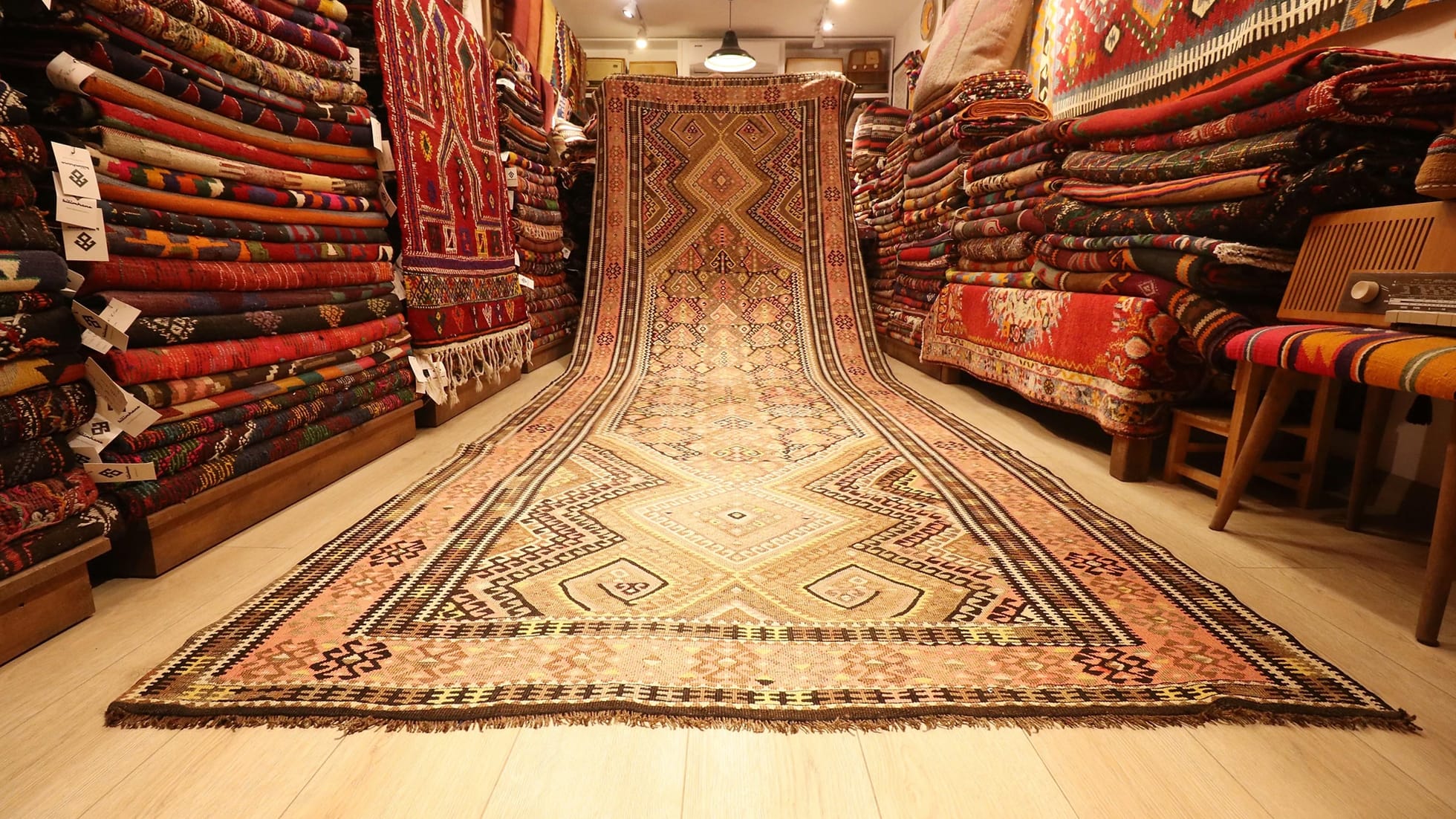 oriental and rare Oushak runner rug is displayed in a rug store in NYC