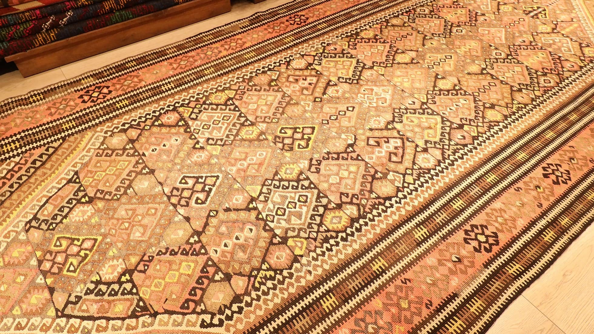traditional Oushak runner kilim rug is displayed in a rug store in NYC