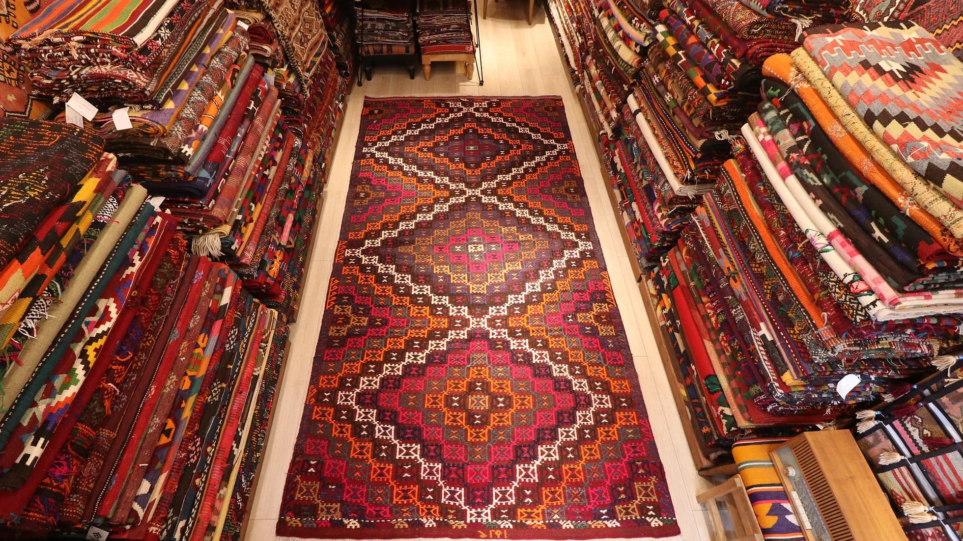 room-sized vintage mid-century Turkish cicim flat-weave runner rug in diamond patterns and pastel earthy colors