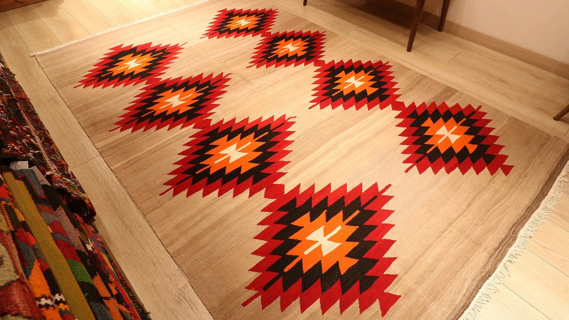 Handwoven Neutral Tribal Turkish Kilim Rug with red and orange lozenge patterns in beige