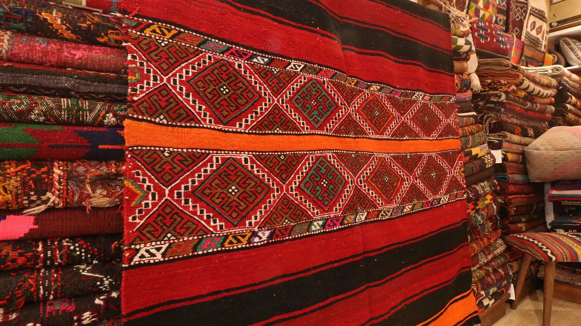 vintage traditional Turkish zili cuval flat rug in tribal motifs and vibrant colors