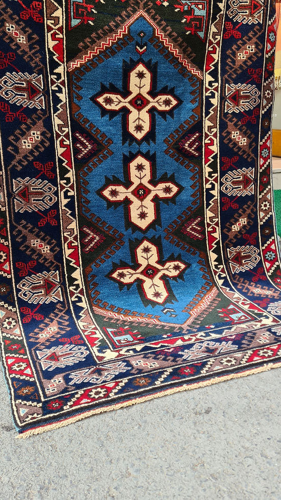 Vintage Turkish Dosemealti area rug from 1960s-1970s, 4x6 ft, handwoven in Antalya with Gordes knot. Features sky blue base, ivory accents, and deep sapphire and onyx tones, crafted from natural wool.