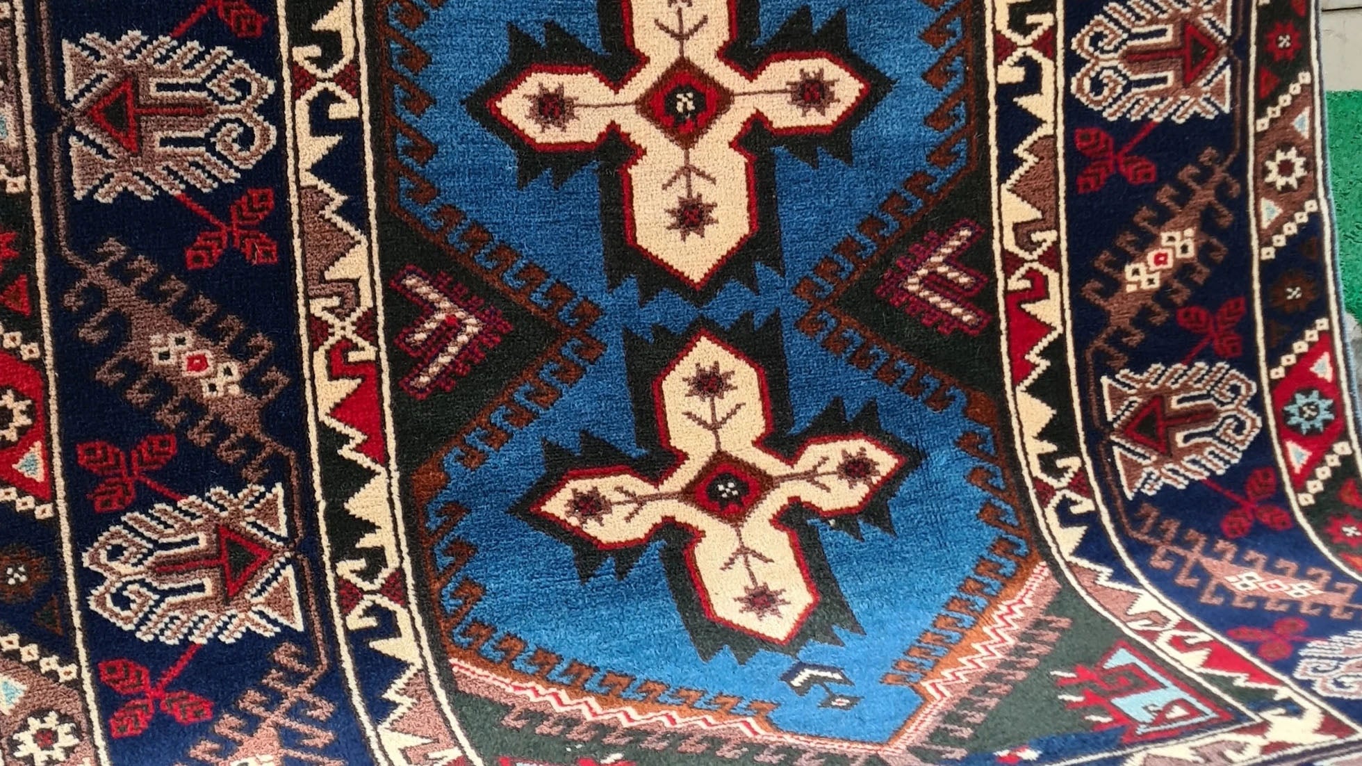 Vintage Turkish Dosemealti area rug from 1960s-1970s, 4x6 ft, handwoven in Antalya with Gordes knot. Features sky blue base, ivory accents, and deep sapphire and onyx tones, crafted from natural wool.
