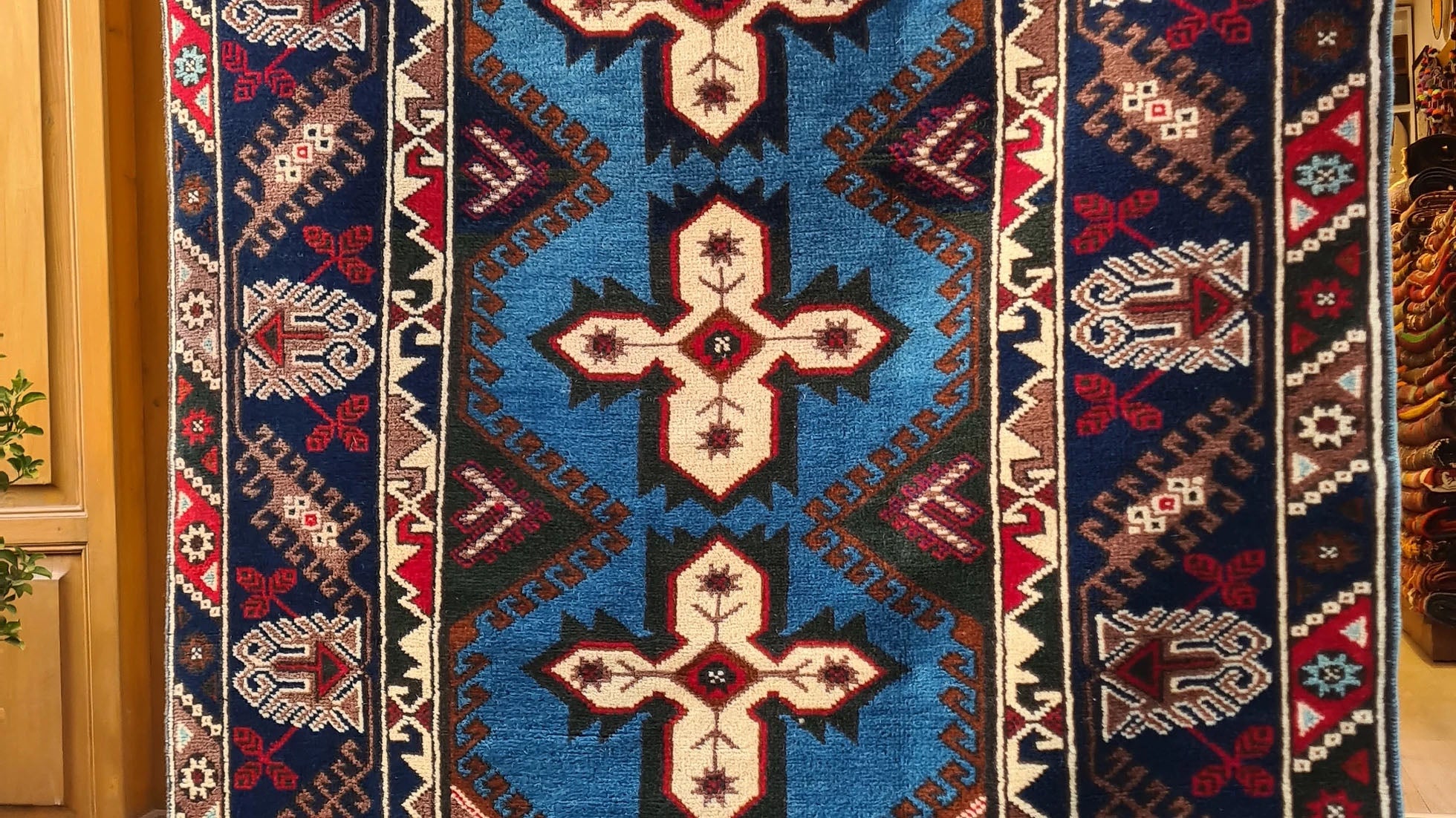 Vintage Turkish Dosemealti area rug from 1960s-1970s, 4x6 ft, handwoven in Antalya with Gordes knot. Features sky blue base, ivory accents, and deep sapphire and onyx tones, crafted from natural wool.