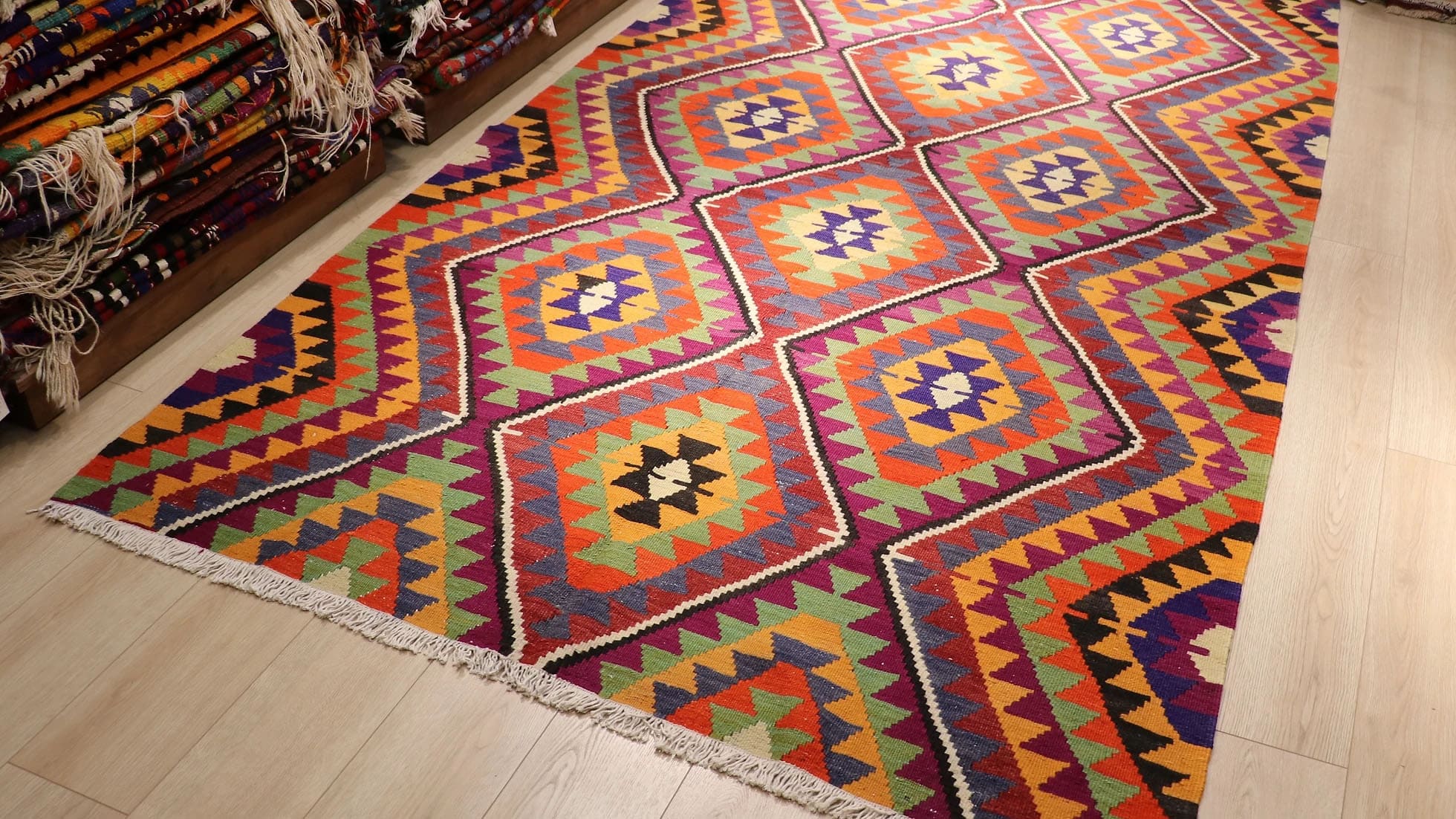 a beautiful handwoven Turkish kilim rug in traditional and tribal motifs made by nomadic women weavers