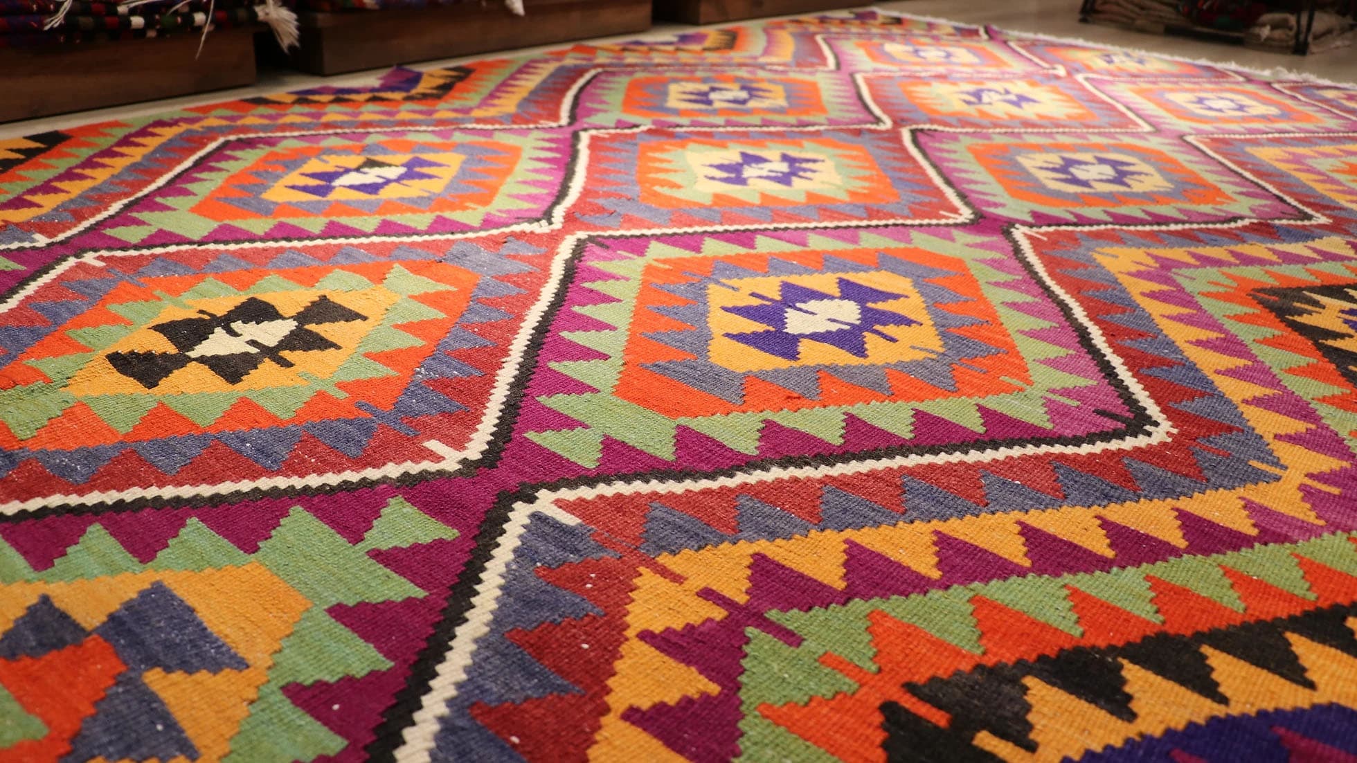 a beautiful handwoven Turkish kilim rug in traditional and tribal motifs made by nomadic women weavers