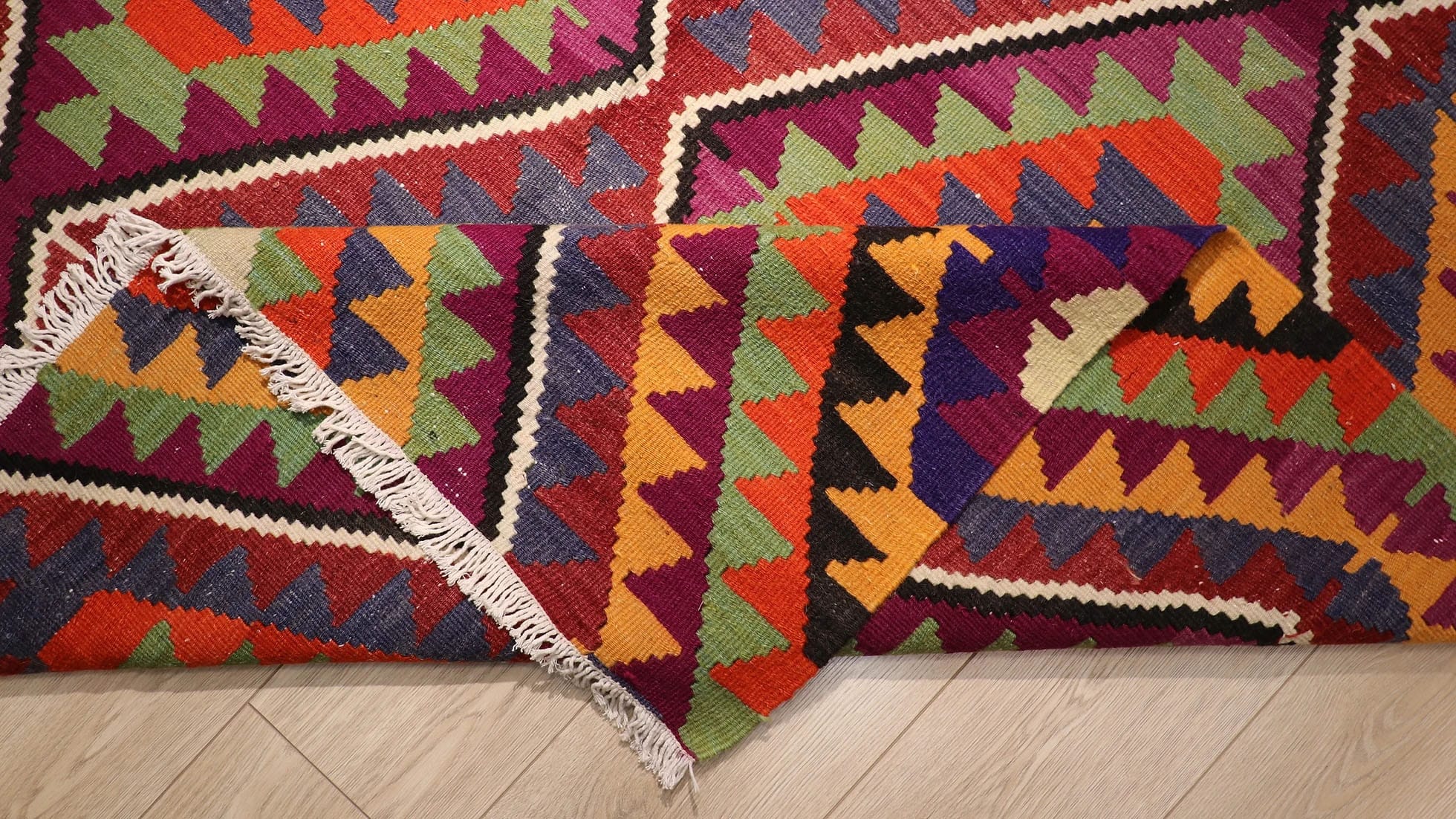 details of the beautiful handwoven Turkish kilim rug in traditional and tribal motifs made by nomadic women weavers