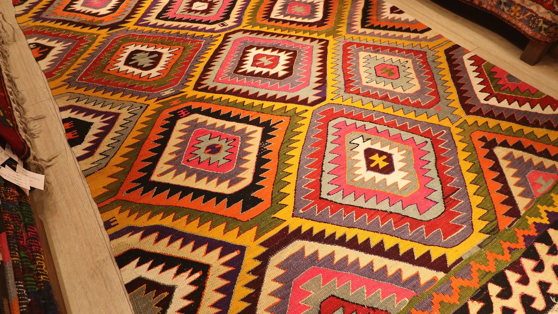 a magnificent mid-century Turkish tribal rug in bright and bold colors and geometric diamond patterns from Antalya