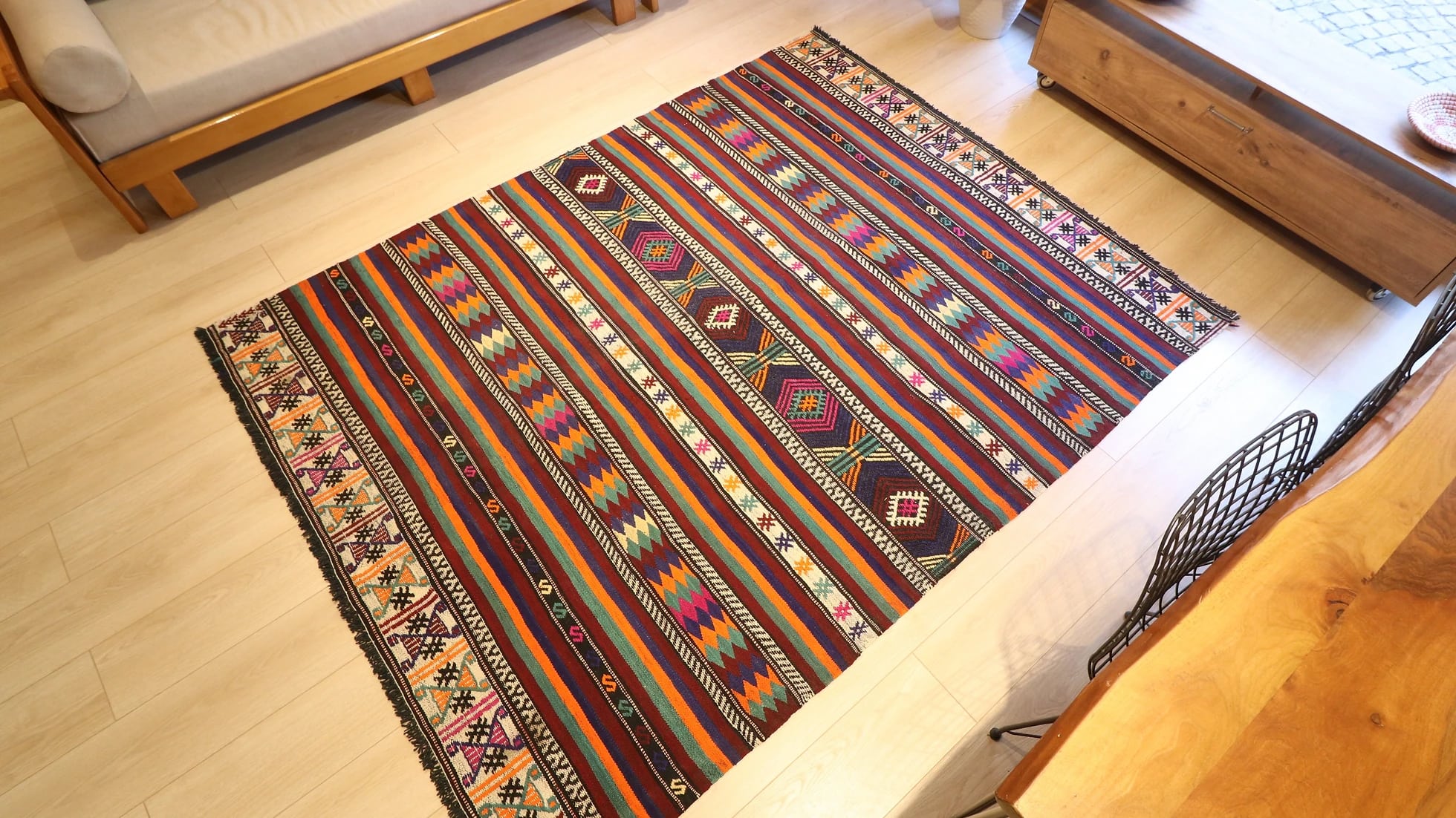 vintage Turkish handwoven kilim rug with vivid and vibrant colors, geometric stripes, and traditional motifs