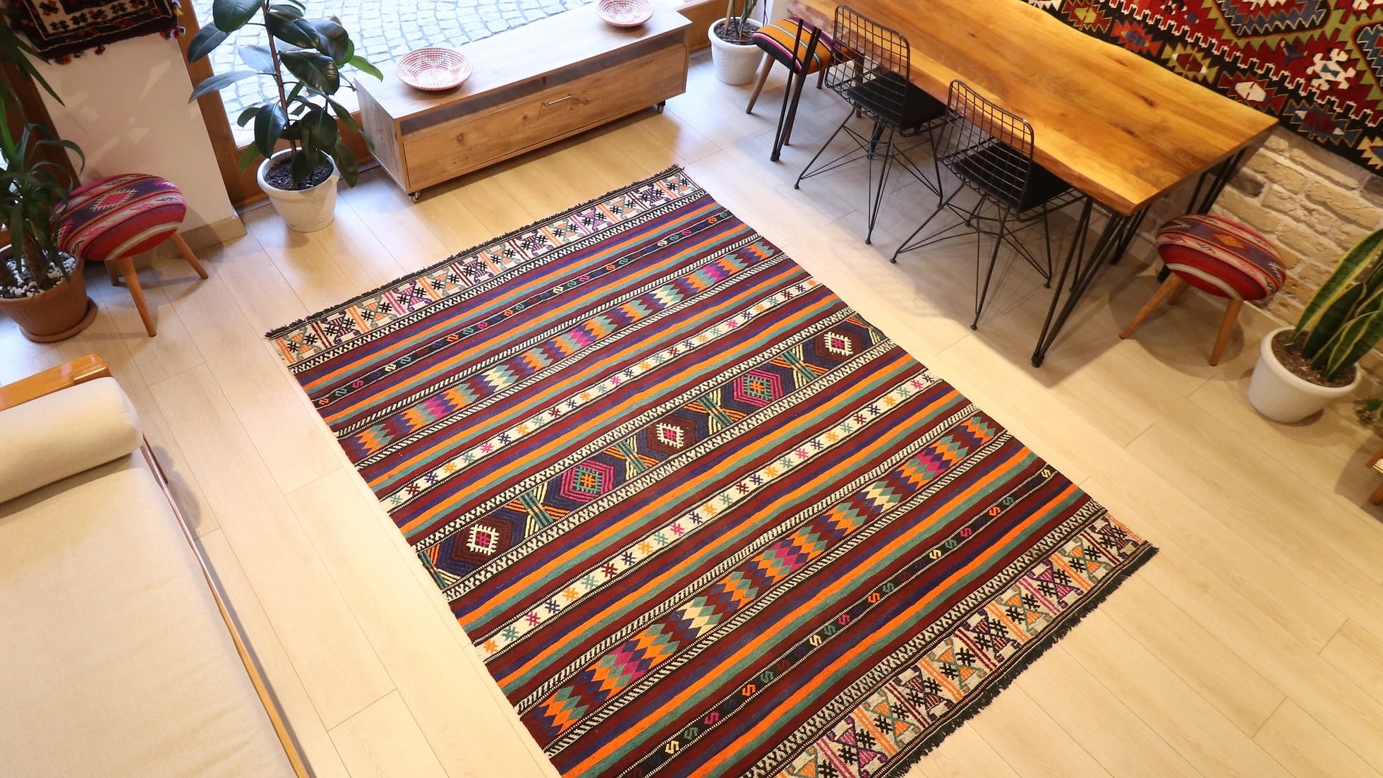 vintage Turkish handwoven kilim rug with vivid and vibrant colors, geometric stripes, and traditional motifs