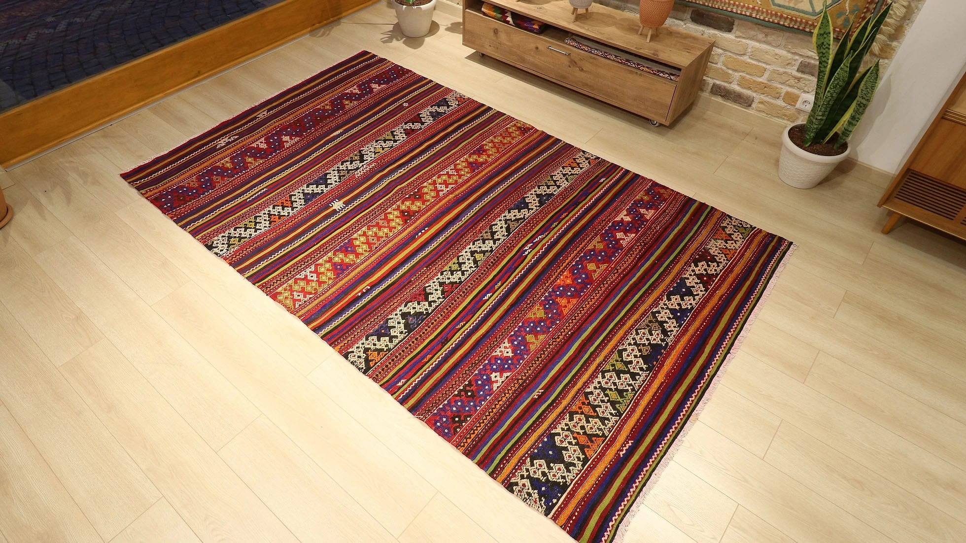 a vibrant and vivid mid-century Turkish kilim rug from Balikesir in traditional patterns and multicolored geometric stripes by Kilim Couture New York rug gallery