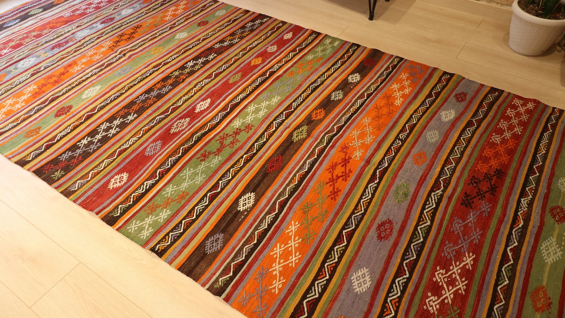 1960s large hallway runner rug in rustic earth tones such as brown, red, orange, gray, and green by Kilim Couture New York