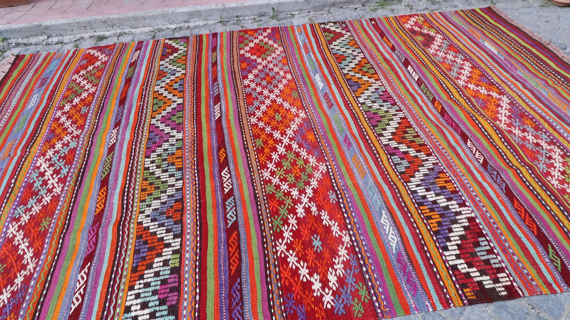 very colorful and pleasing layered and striped balikesir nomadic kilim rug in Yoruk style
