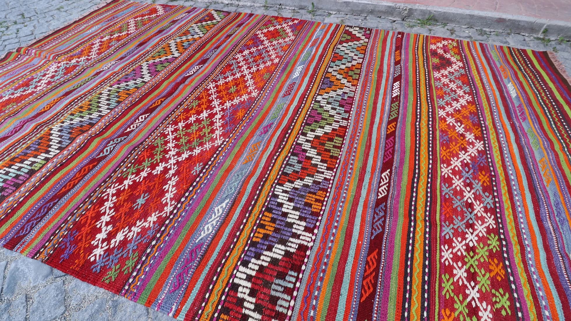 very colorful and pleasing layered and striped balikesir nomadic kilim rug in Yoruk style