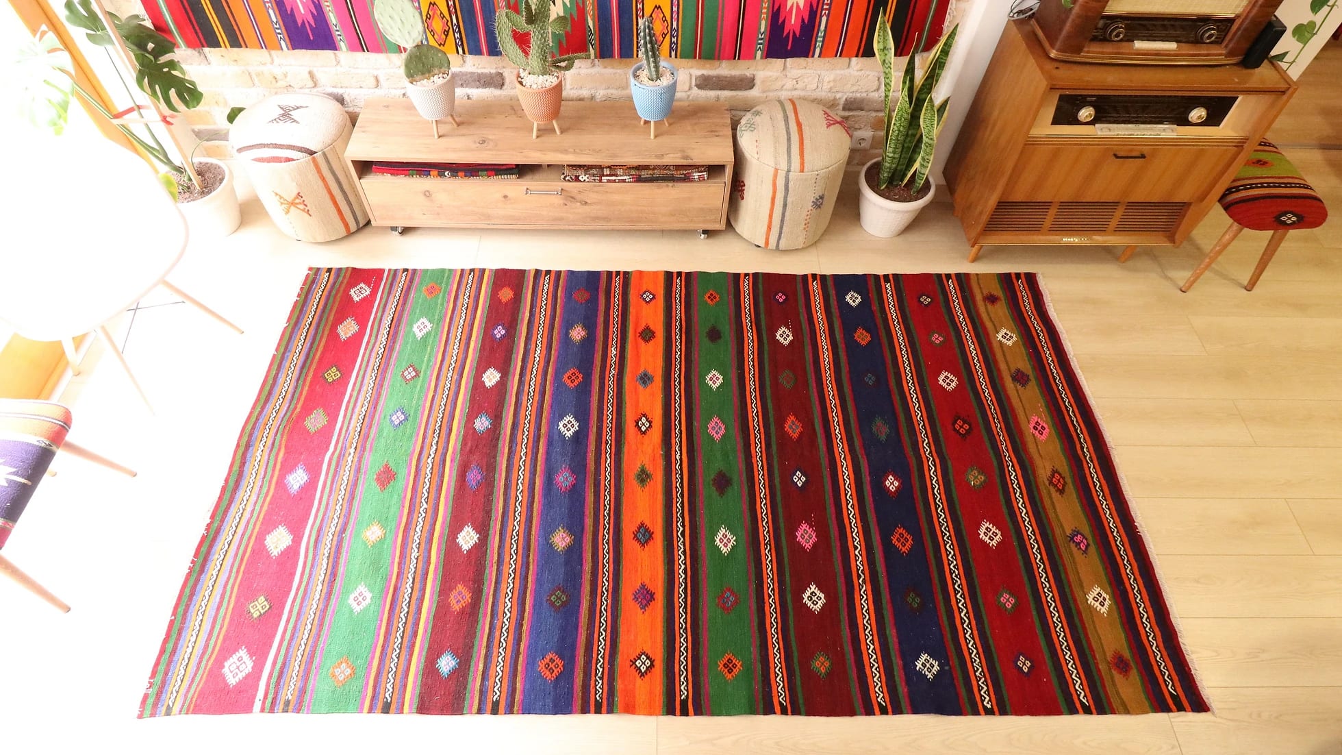 vintage handmade Turkish quilt with geometric patterns and stripes in earthy tones