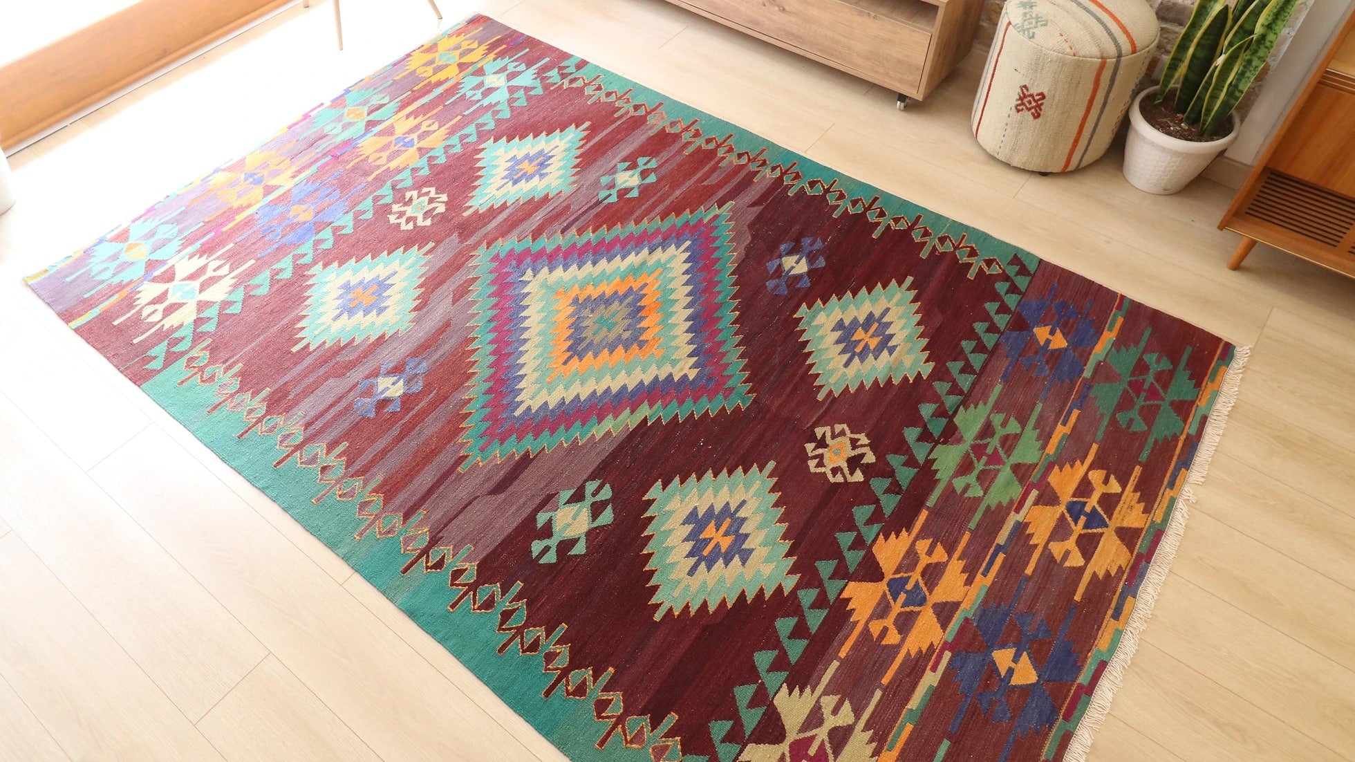 a tribal and traditional contemporary Cal kilim rug in green, blue, orange and red 1960s