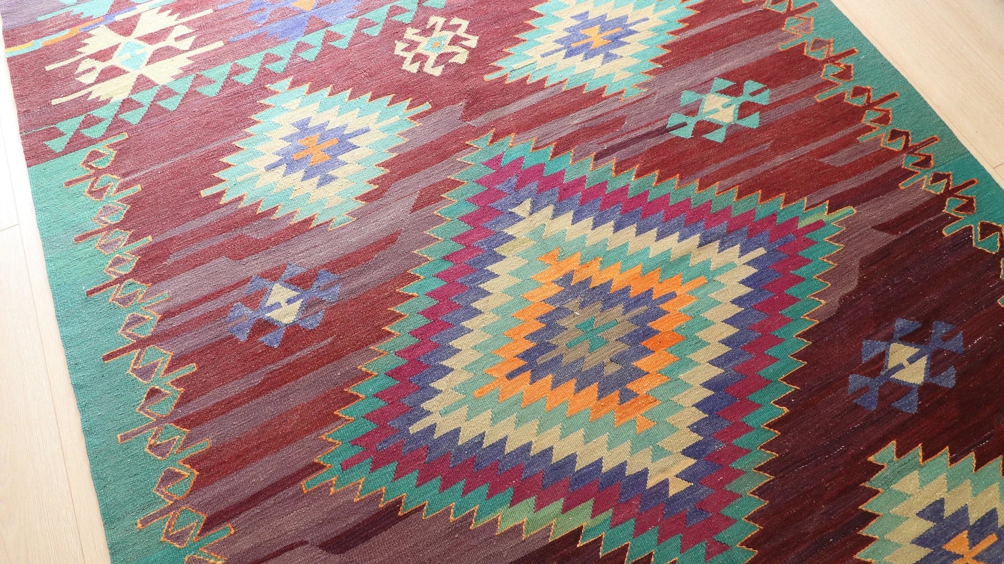 a tribal and traditional contemporary Cal kilim rug in green, blue, orange and red 1960s