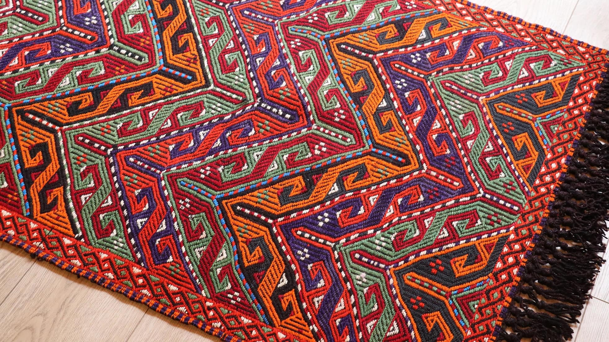 vintage hand-knotted Turkish traditional small kilim rug in orange, red, and green