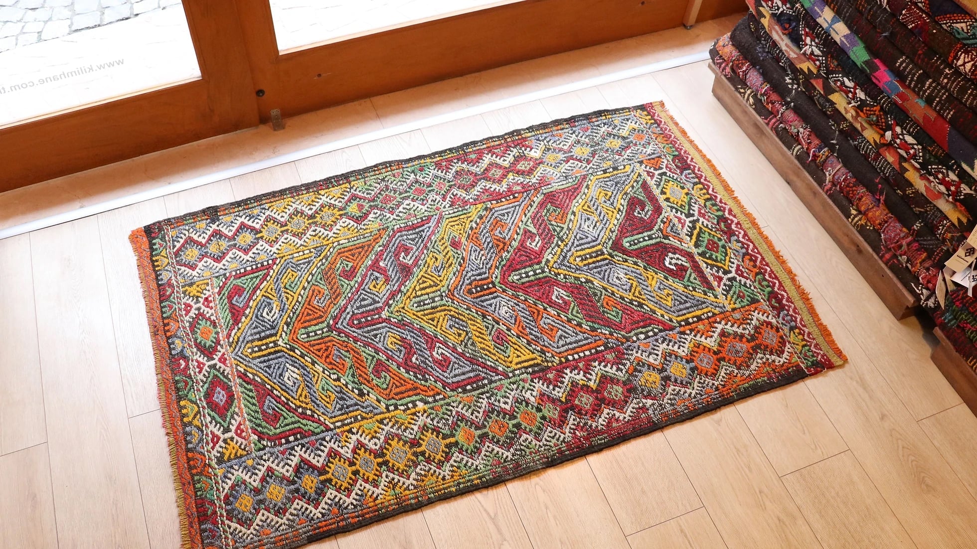 vintage mid-century Turkish rug from 1950s featuring traditional kilim motifs in many vivid and vibrant colors