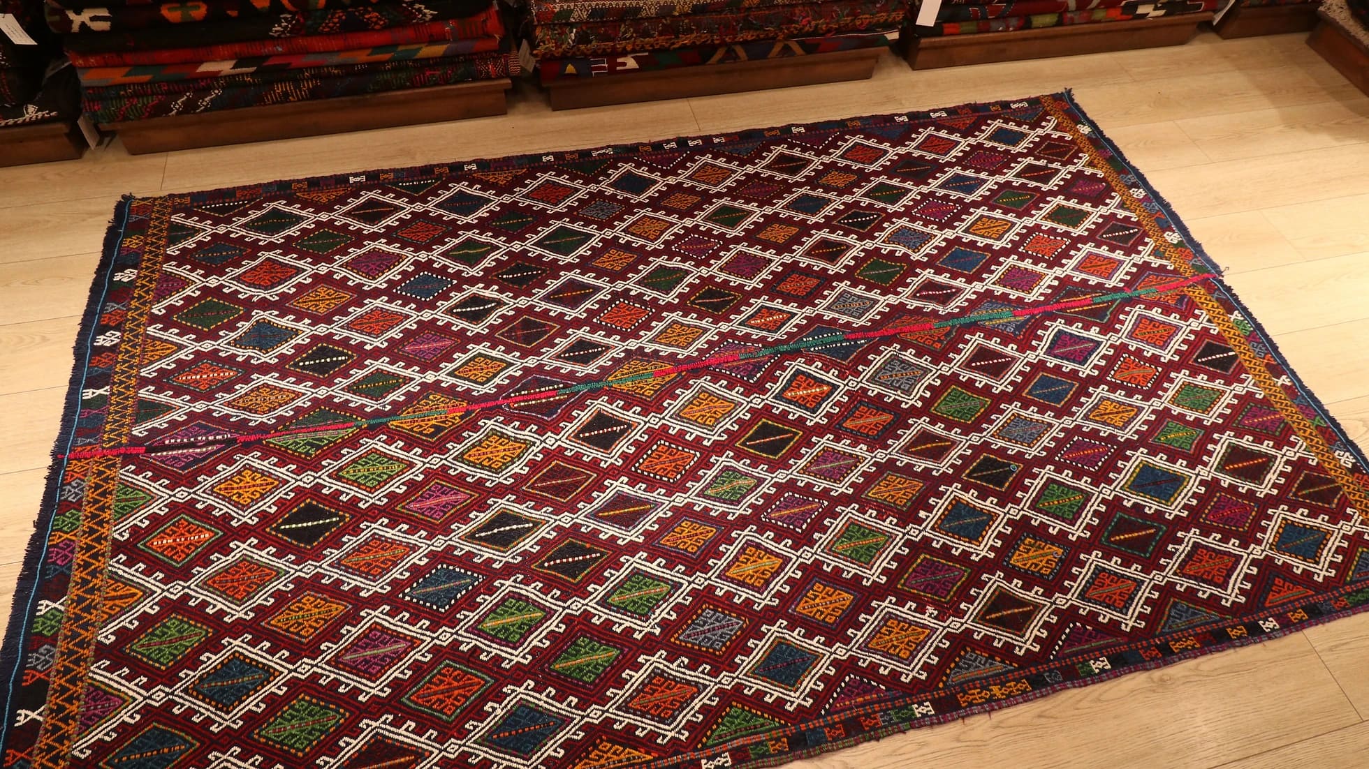 a perfect mid-century tribal Kurdish rug from Denizli, Turkey featuring traditional kilim motifs in muted and faded earth tones