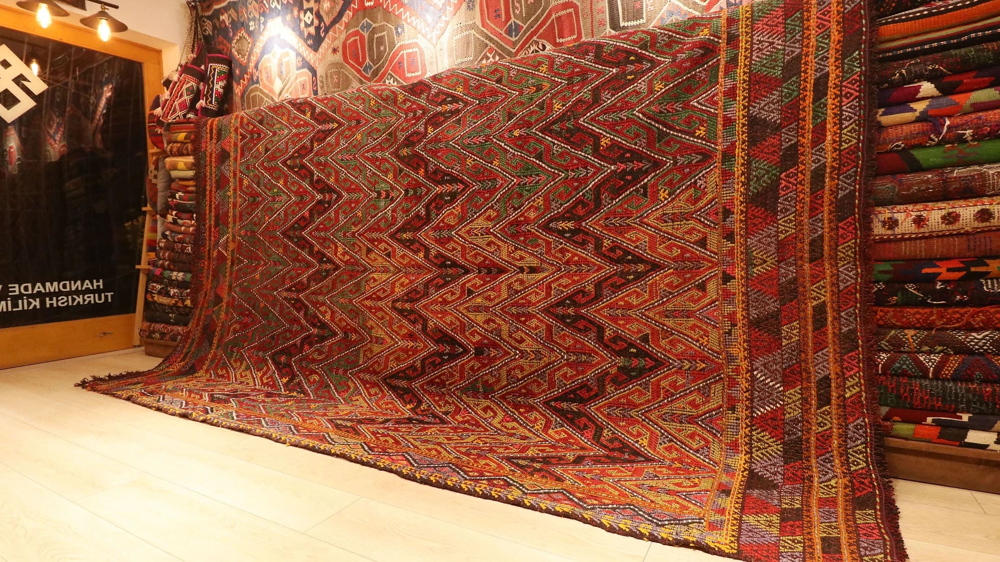 a majestic oriental Kurdish kilim rug in rustic earth tones woven by Anatolian women weavers sustainably
