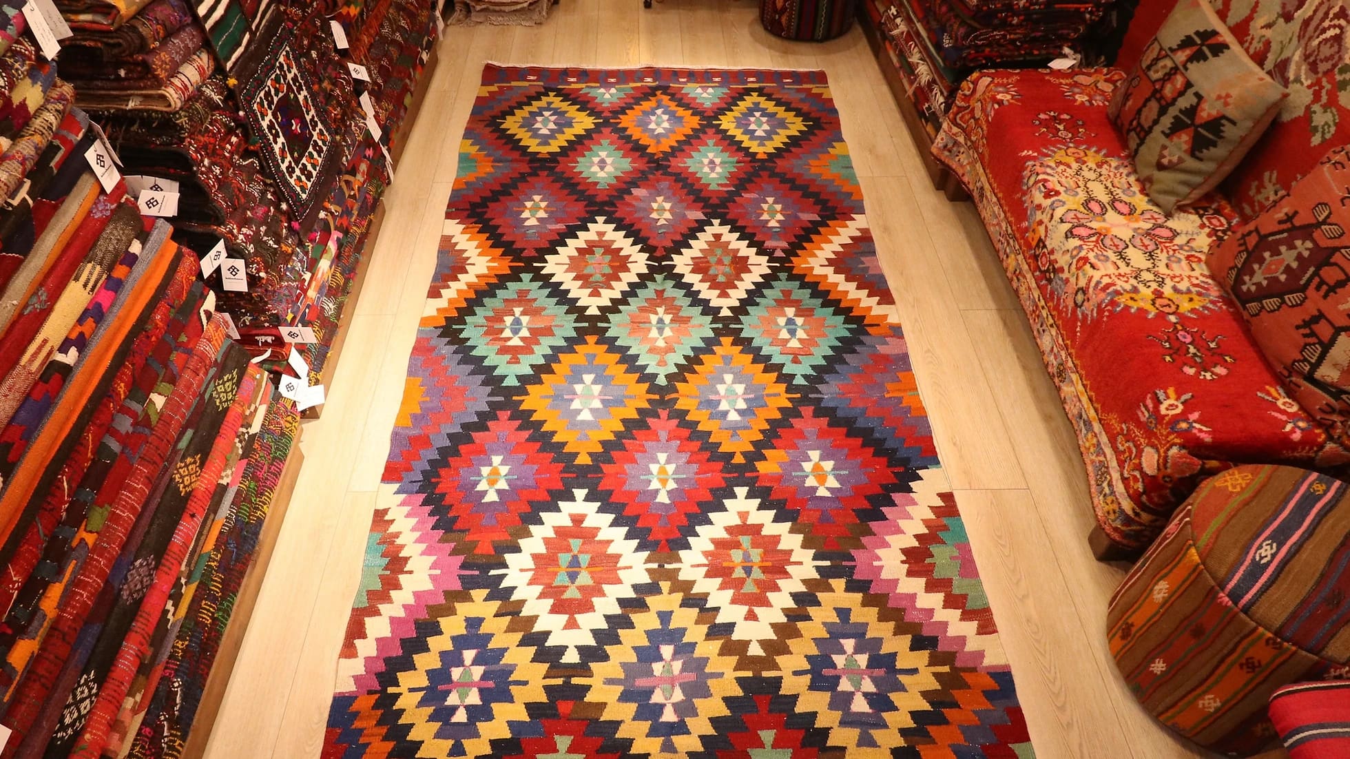 colorful, vibrant, and vivid ethnic Turkish tribal rug in traditional motifs