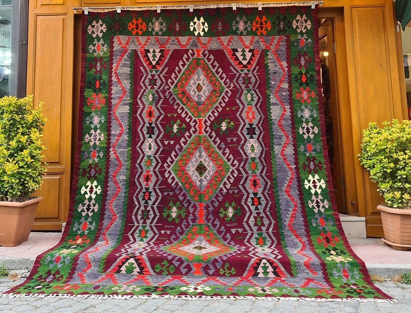 Vintage Handmade Turkish Rug with geometric patterns in red, grey, green in tribal style