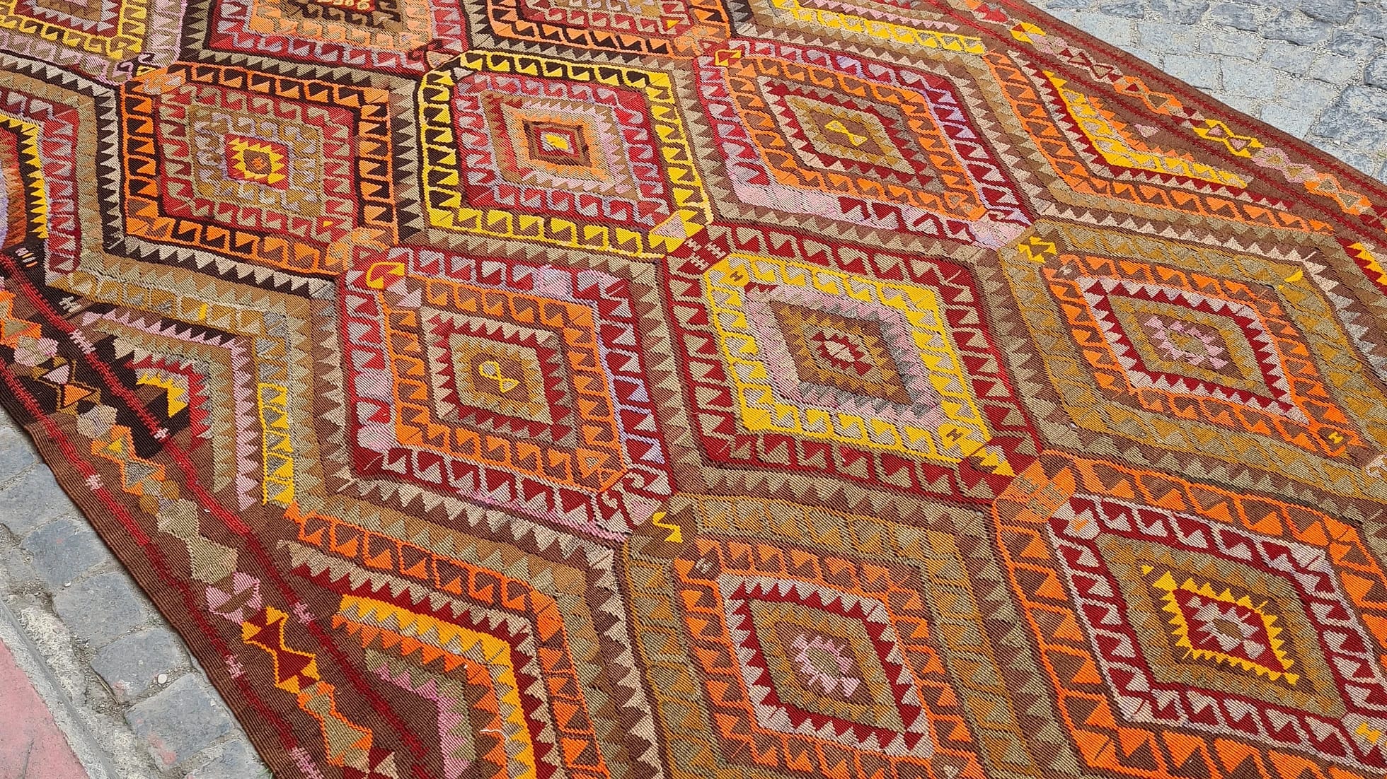 vintage handcrafted Turkish tribal rug in Yoruk style in saffron yellow and bronze orange from mid-century