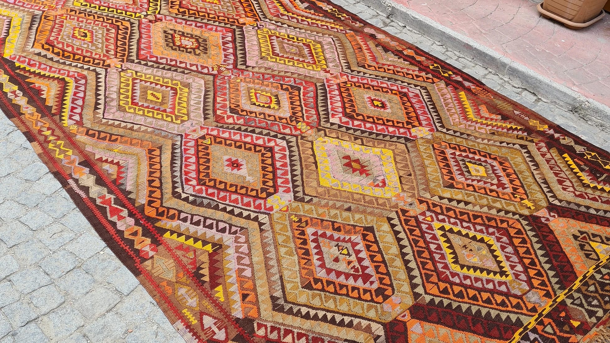 vintage handcrafted Turkish tribal rug in Yoruk style in saffron yellow and bronze orange from mid-century