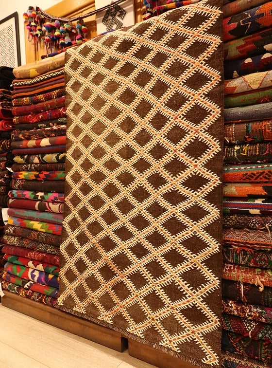 rare hand-knotted flat-woven rug in earthy rustic colors and diamond patterns from 1940s