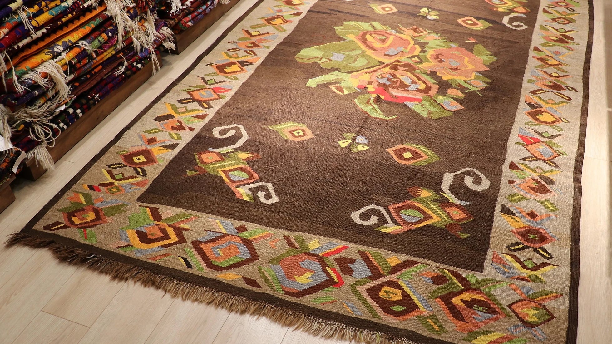 floral antique Turkish tapestry rug from Kars in muted and faded colors featuring giant colorful flower motifs