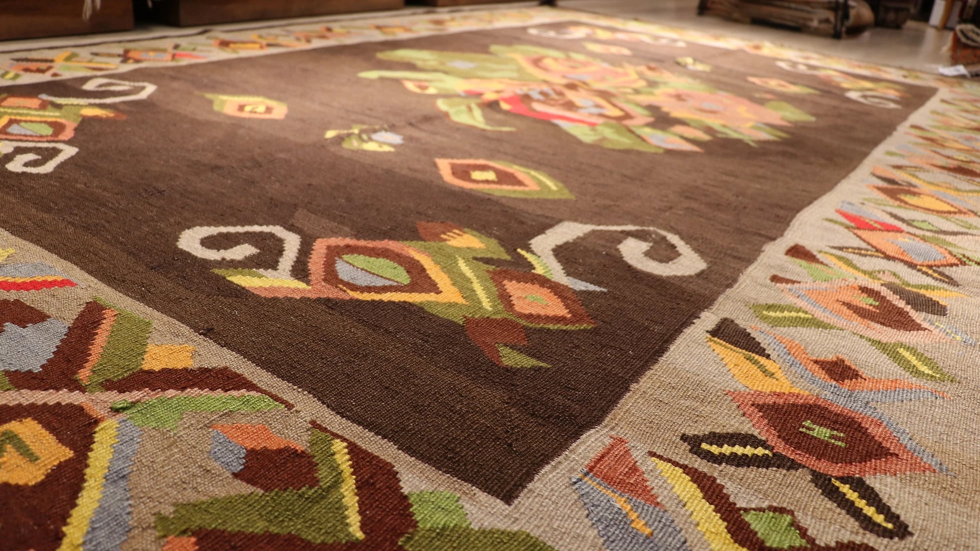 floral antique Turkish tapestry rug from Kars in muted and faded colors featuring giant colorful flower motifs