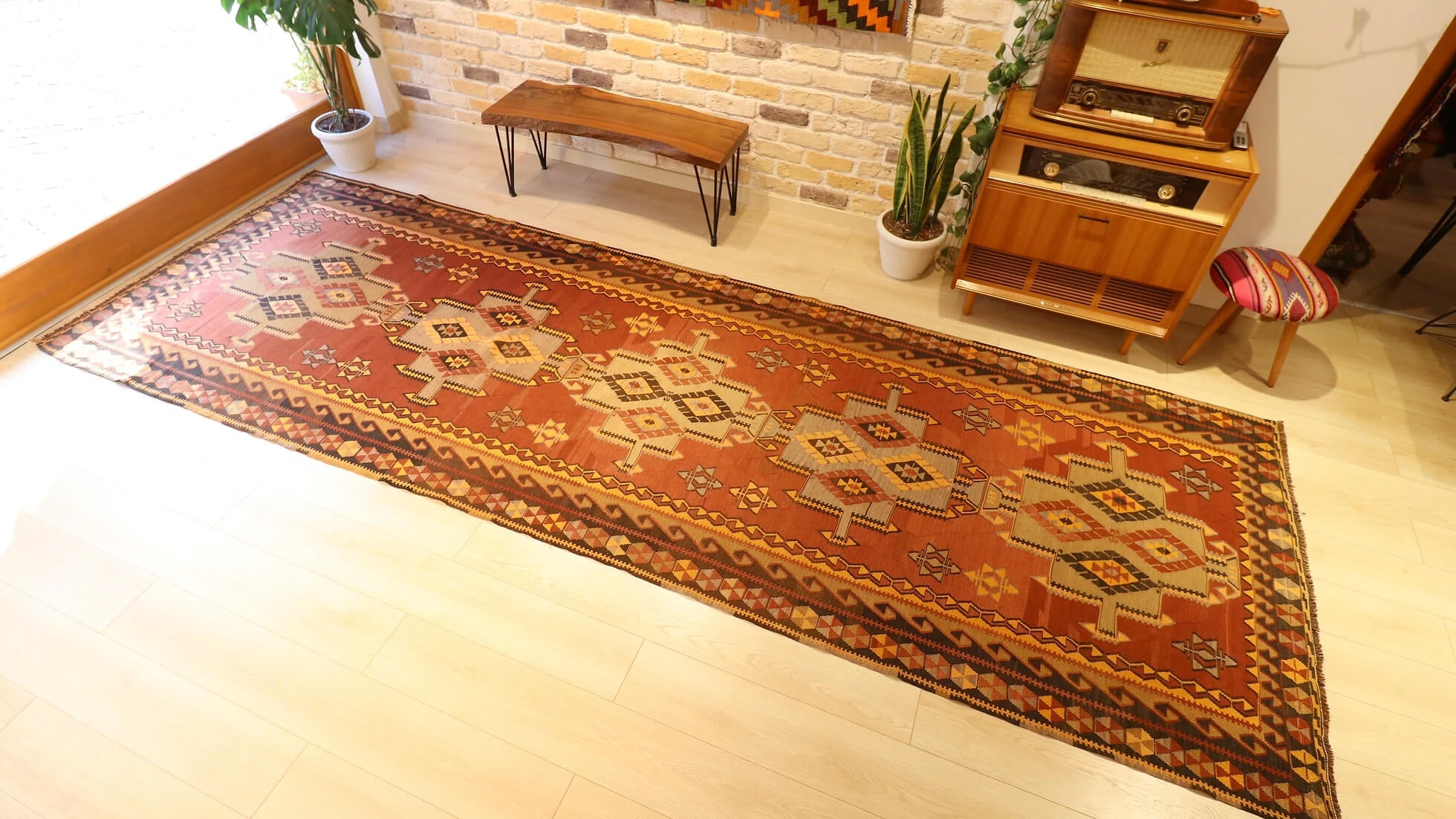 room-sized oversize nomadic Kars gallery runner rug in geometric medallion patterns and muted earth tones