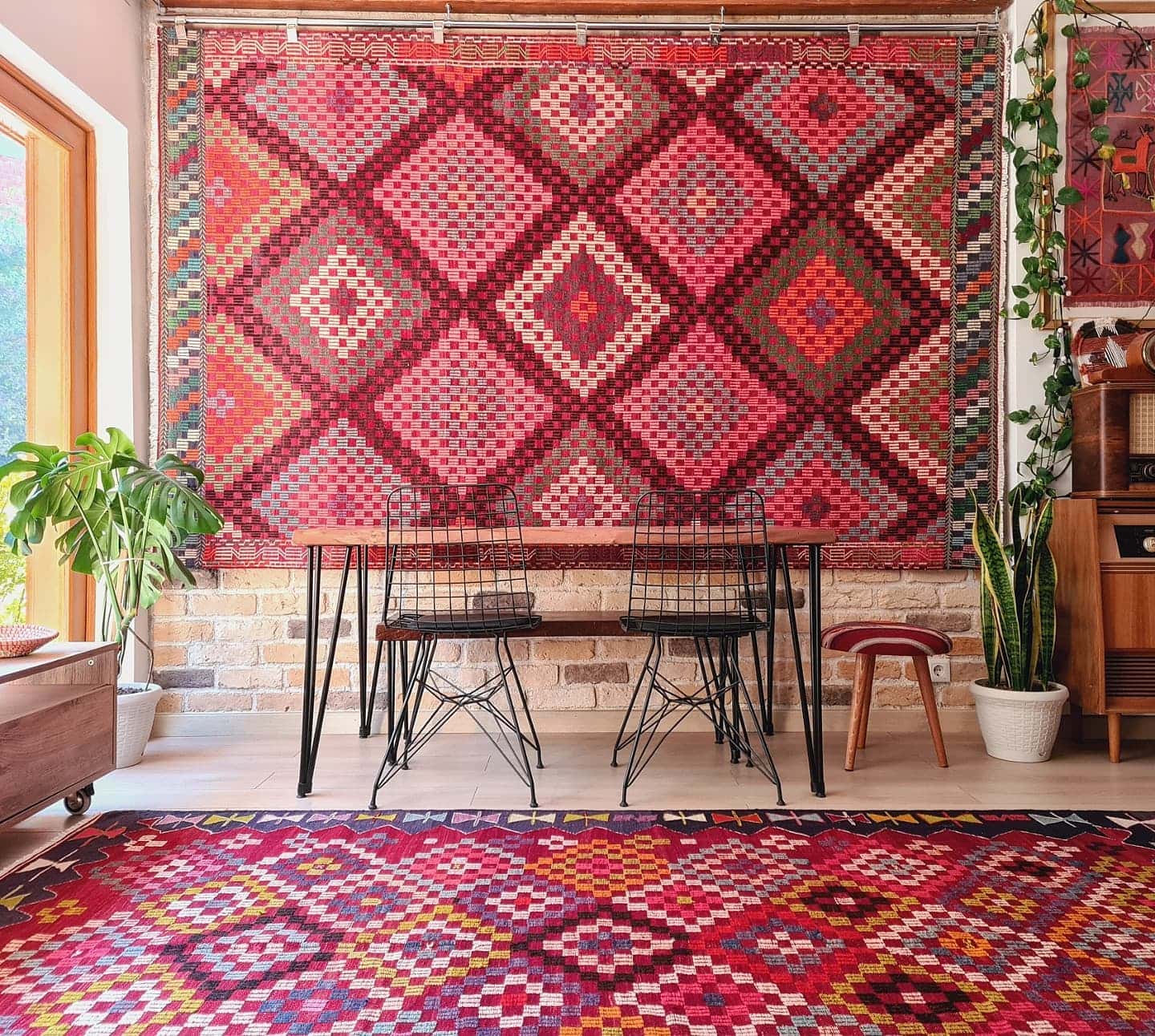vintage handwoven Turkish wool rug in pastel pink, green, orange, blue, and purple tribal diamond patterns