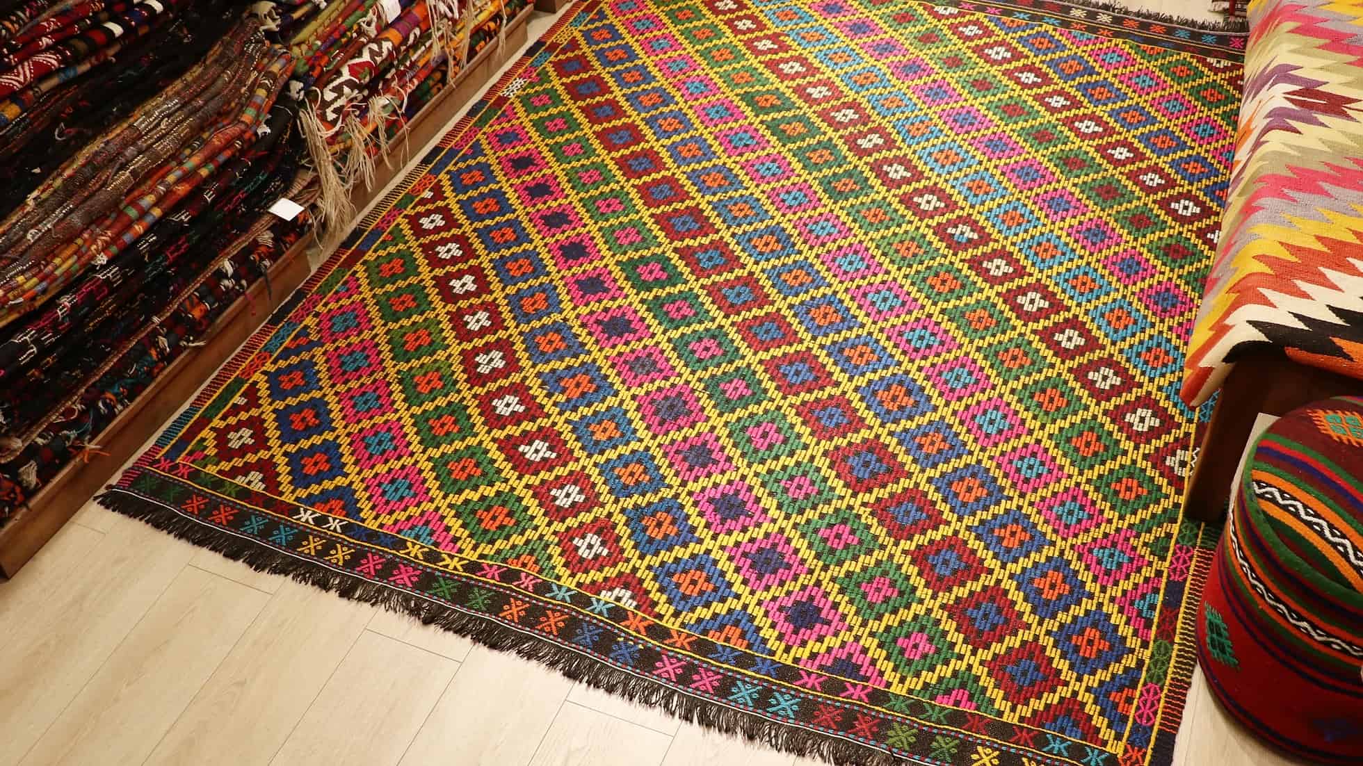 vintage mid-century geometric cecim rug with diamond patterns in vivid and vibrant colorful hues by Kilim Couture New York