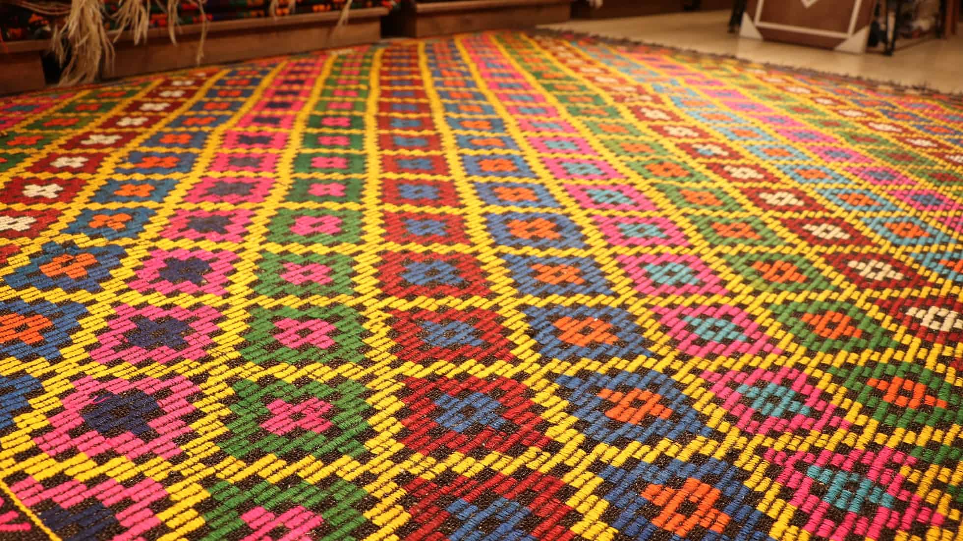 vintage mid-century geometric cecim rug with diamond patterns in vivid and vibrant colorful hues by Kilim Couture New York