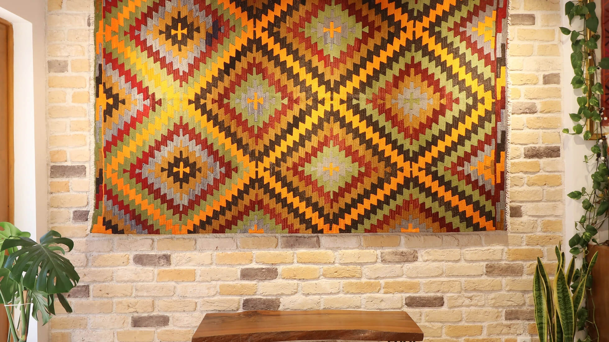 a 5x8 polychromatic luxury modern handwoven Turkish flat-woven rug in diamond and lozenge patterns