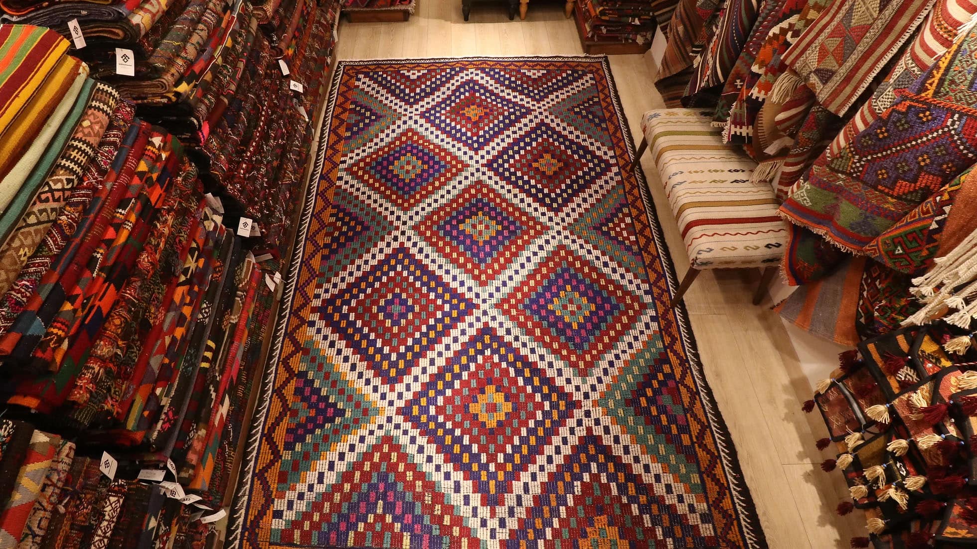 a magnificent vintage mid-century eclectic Turkish rug in many vibrant and vivid colors with traditional kilim motifs