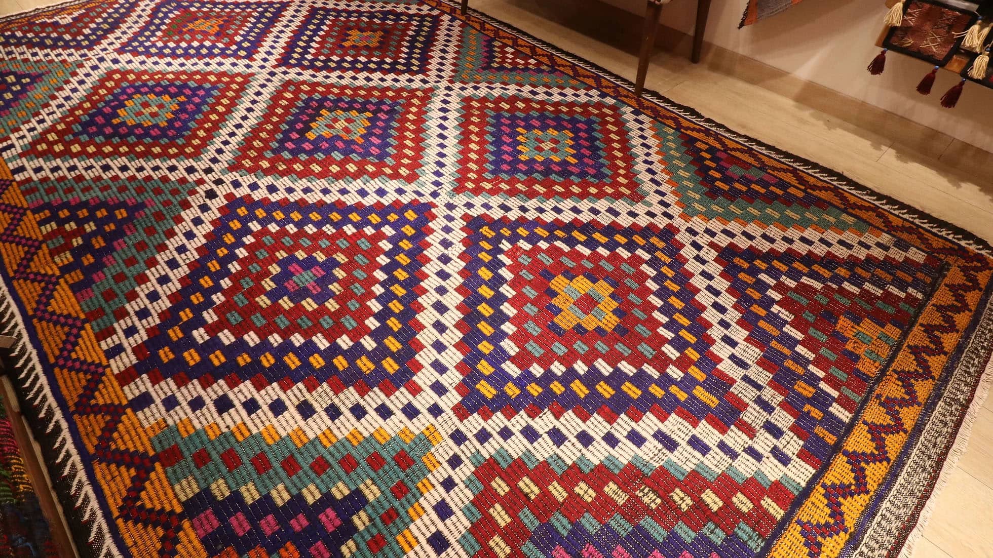 a magnificent vintage mid-century eclectic Turkish rug in many vibrant and vivid colors with traditional kilim motifs