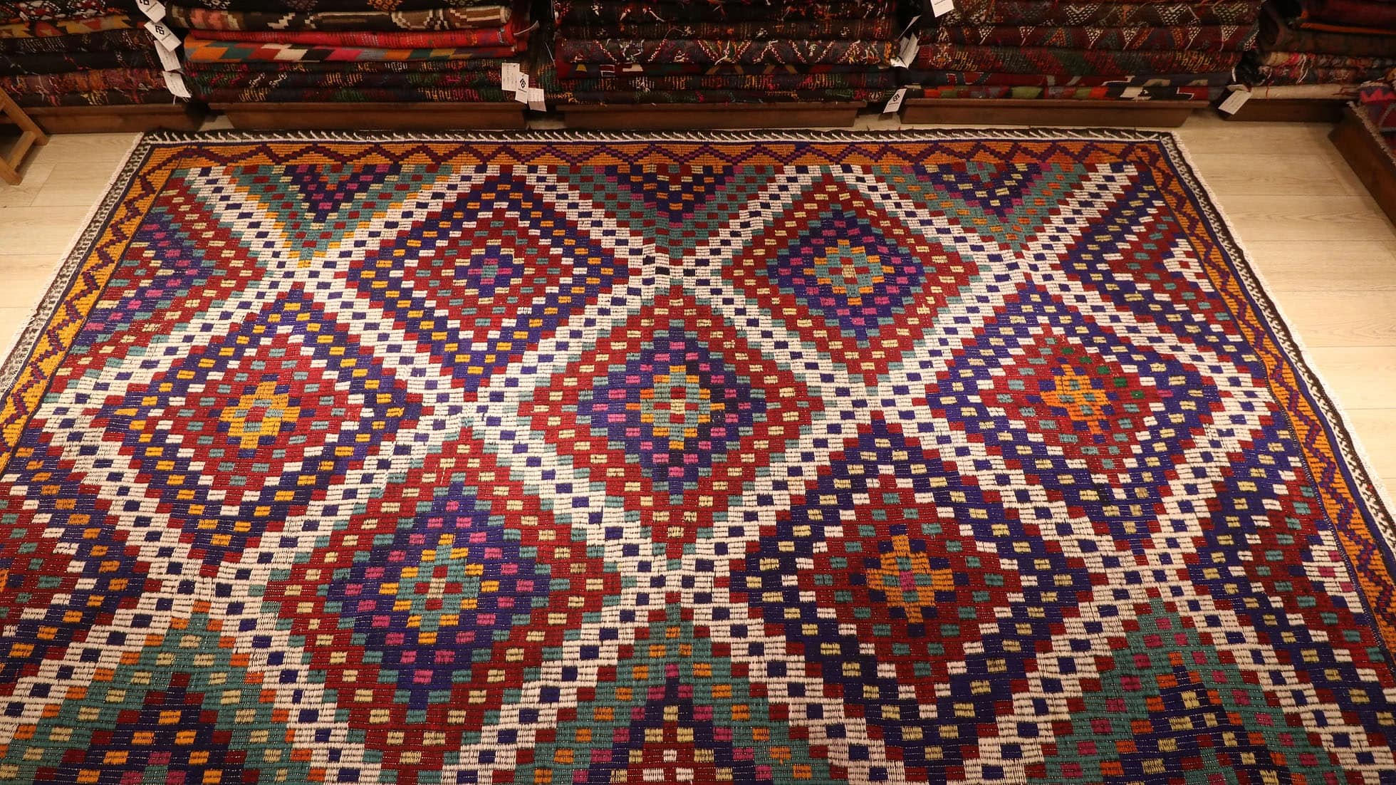 a magnificent vintage mid-century eclectic Turkish rug in many vibrant and vivid colors with traditional kilim motifs