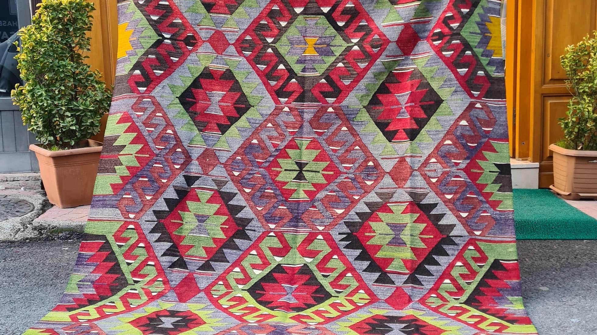 vintage Turkish handwoven tribal and geometric kilim rug from Manisa in rich rustic tones