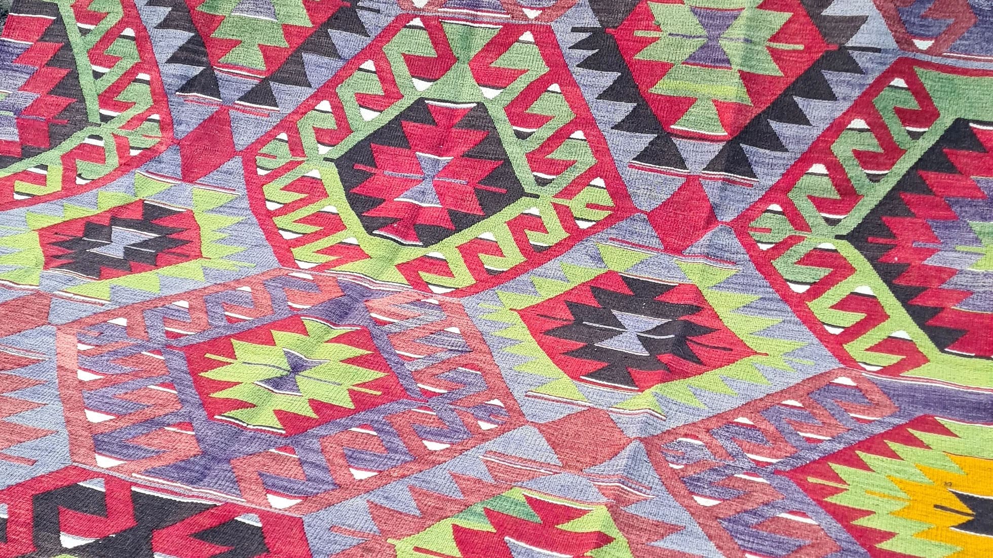 vintage Turkish handwoven tribal and geometric kilim rug from Manisa in rich rustic tones