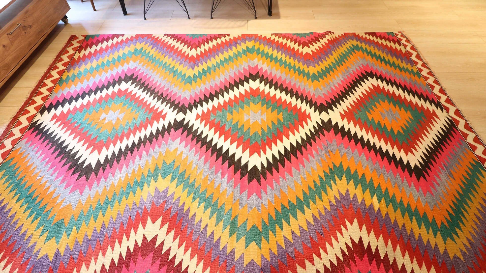 a very rare Turkish mid-century modern wool flat-weave rug in vibrant and colorful diamond and lozenge patterns in contemporary style